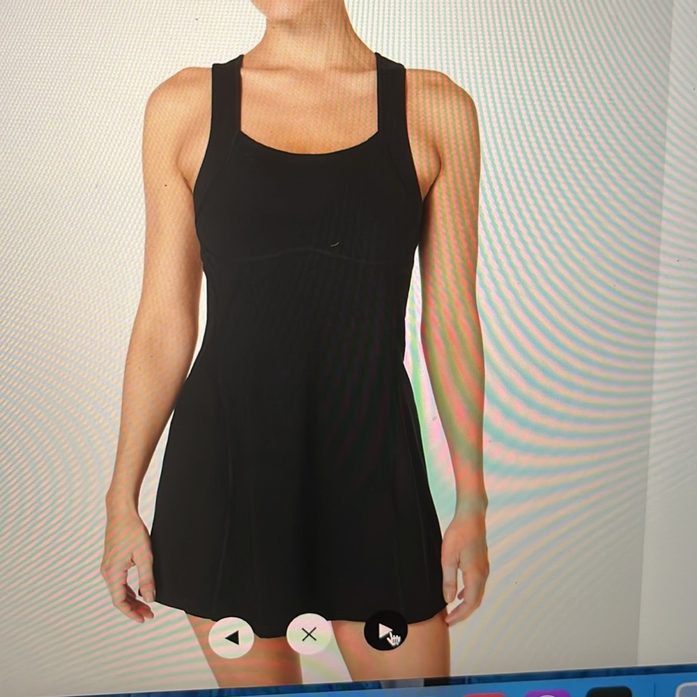 Black, sweaty Betty, tennis dress fit size 4 to 8 tons of stretch. Never worn.